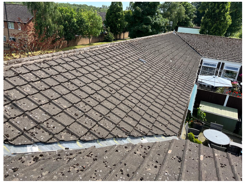 Worn tiled roof before full roof replacement